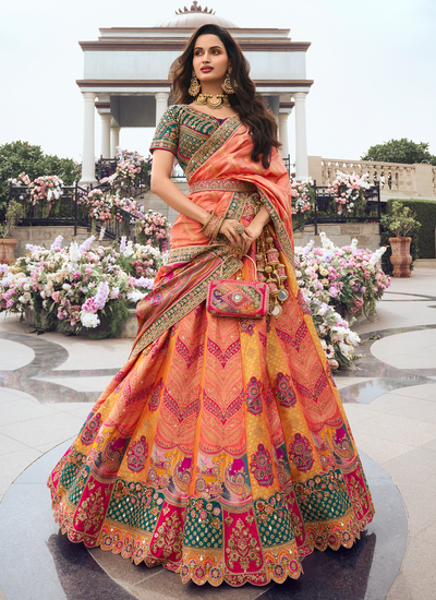 Peach Yellow Bridal Silk Woven Zari Embroidered Lehenga With Dark Green Sequins Embroidered Choli