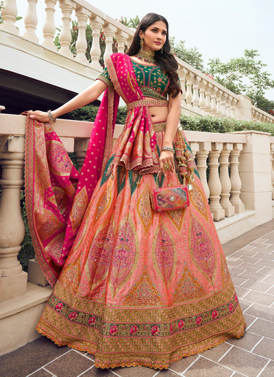 Silk Bridal Peach Zari Woven Stone Work Embroidered Lehenga With Dark Green Sequins Embroidered Choli