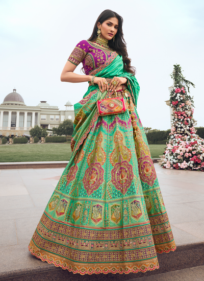 Aqua Green Bridal Zari Woven Stone Work Embroidered Silk Lehenga With Sequins Embroidered Purple Choli