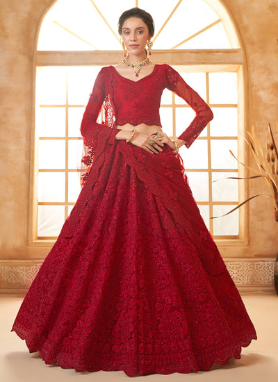 Red Bridal Thread Embroidered With Stone Embellishment And Stone Work Net Lehenga Choli