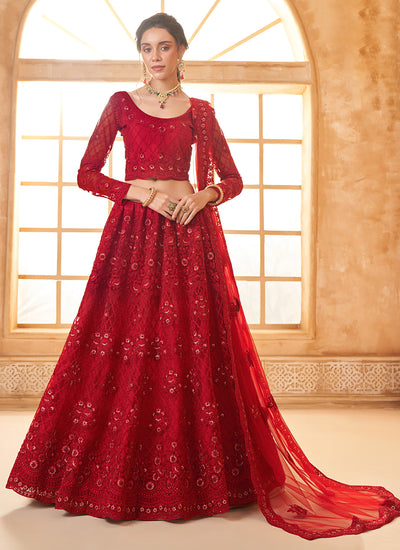 Embroidered Bridal Thread With Stone Embellishment And Stone Work Net Lehenga Choli In Red