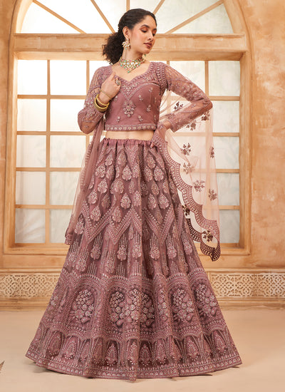 Net Mauve Embroidered Bridal Thread With Stone Embellishment And Stone Work Net Lehenga Choli