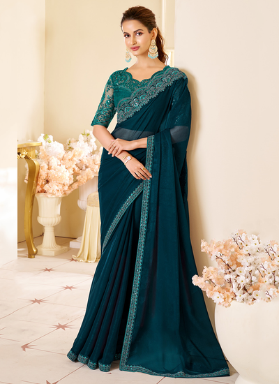 Peacock Blue Party Wear Two Tone Georgette Sequins Embroidered Patch Border Saree With Heavy Blouse