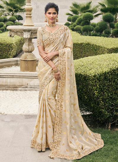 Cream Reception Wear Tissue Silk Zari Woven Stone And Embroidered Saree