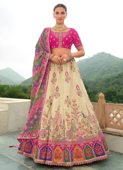 Stone Work Bridal Cream And Rani Silk Sequins Embroidered Lehenga Choli